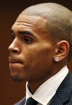 Chris Brown stand before the judge during his sentencing for assaulting his girlfriend Rihanna, at Los Angeles County Superior Court in Los Angeles, Tuesday, Aug. 25, 2009.