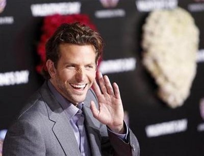 Cast member Bradley Cooper gestures at the premiere of Valentines Day at the Graumans Chinese theatre in Hollywood, California February 8, 2010. The movie opens in the U.S. on February 12.  REUTERS/Mario Anzuoni