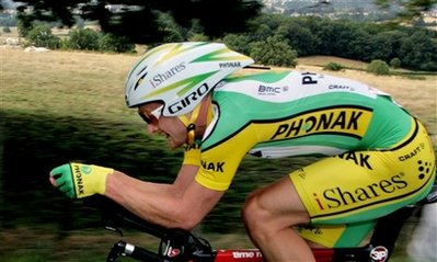FILE - Floyd Landis of the U.S. rides during the 19th stage of the 93rd Tour de France cycling race, a 57-kilometer (35.4-mile) individual time trial from Le Creusot to Montceau-les-Mines, France in this July 22, 2006 file photo.  Frances anti-doping chief said on Monday Feb. 15, 2010 that a French judge has issued an international arrest warrant for U.S. cyclist Floyd Landis in connection with a case of data hacking at a doping laboratory.  (AP Photo/Peter Dejong)