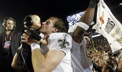 New Orleans Saints quarterback Drew Brees celebrates with his son Baylen after winning the NFL Super Bowl XLIV football game against the Indianapolis Colts in Miami, Sunday, Feb. 7, 2010. The Saints won 31-17. (AP Photo/David J. Phillip)