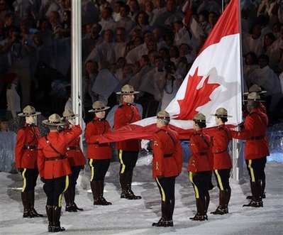 The Canadian flag is raised during the closing ceremony for the Vancouver 2010 Olympics in Vancouver, British Columbia, Sunday, Feb. 28, 2010. (AP Photo/Gerry Broome)