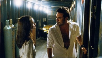 In this film publicity image released by Warner Bros., Jeffrey Dean Morgan, right, and Zoe Saldana are shown in a scene from, The Losers.  (AP Photo/Warner Bros. Pictures)