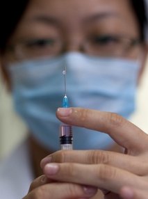 A nurse prepares a vaccine shot against measles at a clinic in Beijing, China, Saturday, Sept. 11, 2010. China wants to vaccinate 100 million children in a 10-day nationwide campaign starting Saturday to bring it a step closer to eradicating measles. (AP Photo/Alexander F. Yuan)