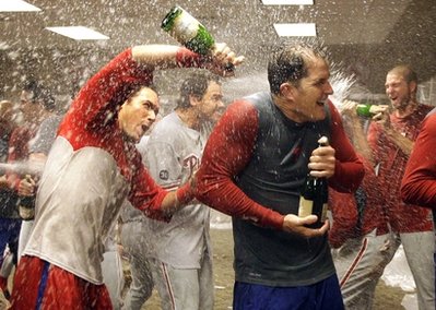 The Philadelphia Phillies celebrate in their clubhouse after sweeping the Cincinnati Reds with a 2-0 win in Game 3 of baseballs National League Division Series Sunday, Oct. 10, 2010, in Cincinnati. (AP Photo/Al Behrman)