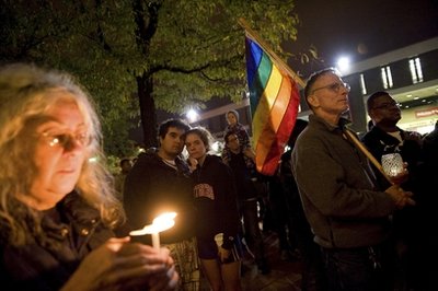 People participate in a candlelight vigil for Rutgers University freshman Tyler Clementi at Brower Commons on the university campus in New Brunswick, N.J., Sunday, Oct. 3, 2010. Clementi jumped to his death off a bridge a day after two classmates surreptitiously recorded him having sex with a man in his dorm room and broadcast it over the Internet. (AP Photo/Reena Rose Sibayan)