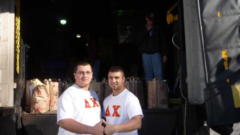 Two brothers from the Delta Chi Fraternity at the University of New Haven participating in the Halloween-for-Hunger food drive.