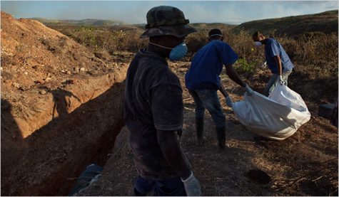 With the death toll rising in Haiti, the bodies of cholera victims are carried to dumping grounds in Port-au-Prince.
