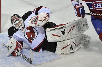 New Jersey Devils goaltender Martin Brodeur grimaces after making a save against the Montreal Canadiens during the first period of an NHL hockey game, Sunday, Feb. 6, 2011, in Montreal. Brodeur left the game after the first period with an undisclosed injury. (AP Photo/The Canadian Press, Graham Hughes)