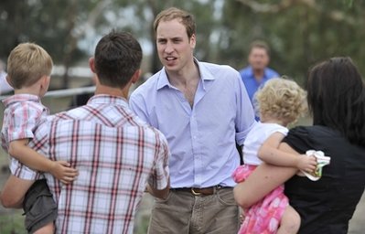 FILE - This is a  Monday, March 21, 2011 file photo of Britains Prince William, facing camera, as he greets Brad, left, and Leonie Wren during his visit to their property in Benjeroop, Victoria, Australia. Prince William is visiting a flood-hit farming region in southern Australia as he wraps up a visit to disaster zones in Australia and New Zealand.  Prince William looks and sounds good, standing tall as he prepares for married life. But it is possible that the future kings easy self-assurance and quality tailoring masks some damage caused by his parents failed marriage and his mothers death. (AP Photo/Paul Crock, Pool, File)