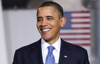 President Barack Obama smiles during an event to promote clean energy vehicles, Friday, April 1, 2011,  at a UPS facility  in Landover, Md.  (AP Photo/Evan Vucci)