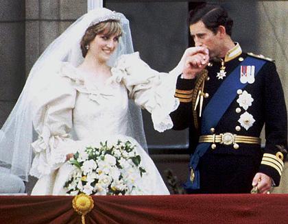 Princess Diana and her new husband Charles, Prince of Wales standing at the balcony at Buckingham Palace after their wedding ceremony.
