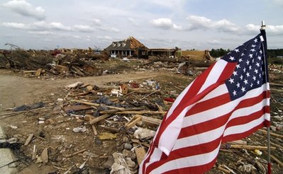 American flags are displayed throughout Smithville, Miss., Sunday, May 1, 2011, amid Wednesdays tornado damage.  (AP Photo/Rogelio V. Solis)