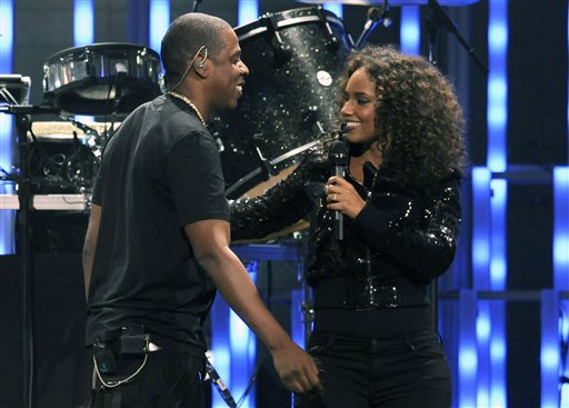 Jay-Z, left, and Alicia Keys are seen onstage during the iHeartRadio music festival on Friday, Sept. 23, 2011, in Las Vegas. (AP Photo/Chris Pizzello)