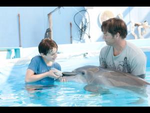 The movie begins when a swimming, young dolphin is caught in a crab trap, which severely damages her tail. She is then rescued and transported to the Clearwater Marine Hospital in Florida and given the name of Winter. 