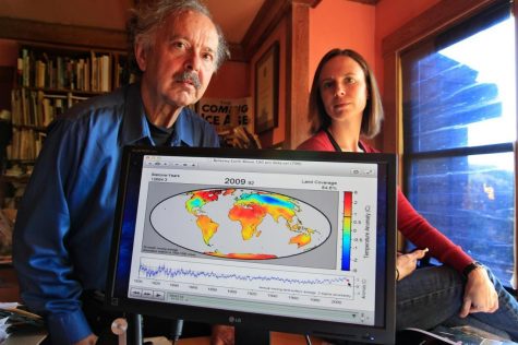 In this Friday, Oct. 28, 2011 photo, Richard Muller, left, and his daughter, Elizabeth Muller, right, pose with a map from their study on climate at their home in Berkeley, Calif. A new study of Earth’s temperatures going back more than 200 years finds the same old story: It’s gotten hotter in the last 60 years. (AP Photo/Paul Sakuma) 