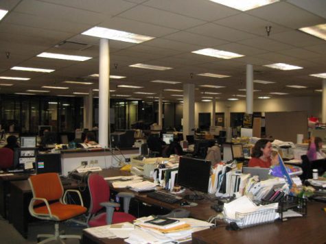 The heart of the New Haven Register’s newsroom remains a place of active collaboration, for now. Photograph by Brandon T. Bisceglia