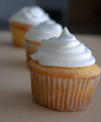 A delicious cupcake filled with cannoli cream and topped with a vanilla cream!