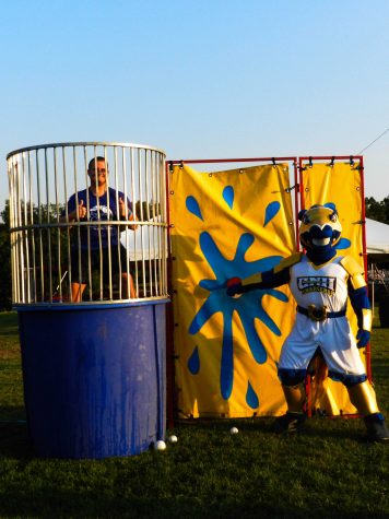 USGA President Patrick Kelland participated in the dunk tank. Students waited anxiously for someone to hit the bulls-eye and send him plummeting into the water below.