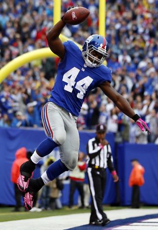 New York Giants running back Ahmad Bradshaw (44) celebrates after scoring a touchdown during the NFL football game against the Cleveland Browns.