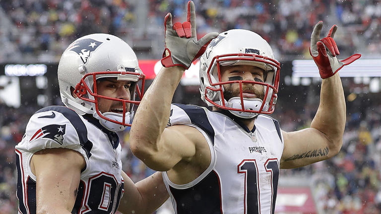 New England Patriots wide receiver Julian Edelman (11) celebrates after catching a touchdown pass with Danny Amendola against the San Francisco 49ers during the first half of an NFL football game in Santa Clara, Calif., Sunday, Nov. 20, 2016. (AP Photo/Marcio Jose Sanchez)
