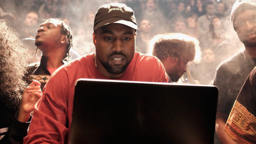 Kanye West at a laptop during his Yeezy Season 3 fashion show and album debut at Madison Square Garden in New York Feb. 11.