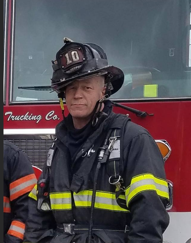 Photo of Stephen Buda in his gear outside of the Bridgeport Fire Department