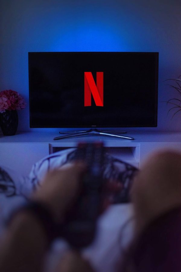 A person watches Netflix from bed.
