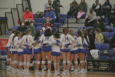 The New Haven volleyball team huddles during their quarterfinal match against Southern New Hampshire University, Nov. 16, West Haven.