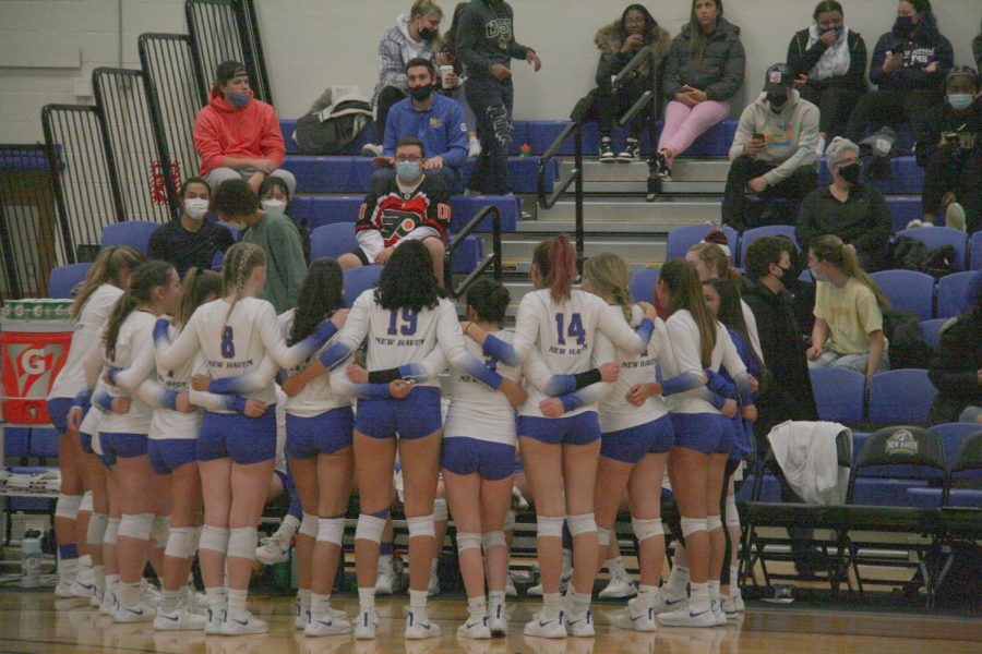 The New Haven volleyball team huddles during their quarterfinal match against Southern New Hampshire University, Nov. 16, West Haven.