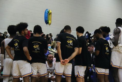 The New Haven men’s basketball team in a timeout, West Haven, Feb. 16. 2022.