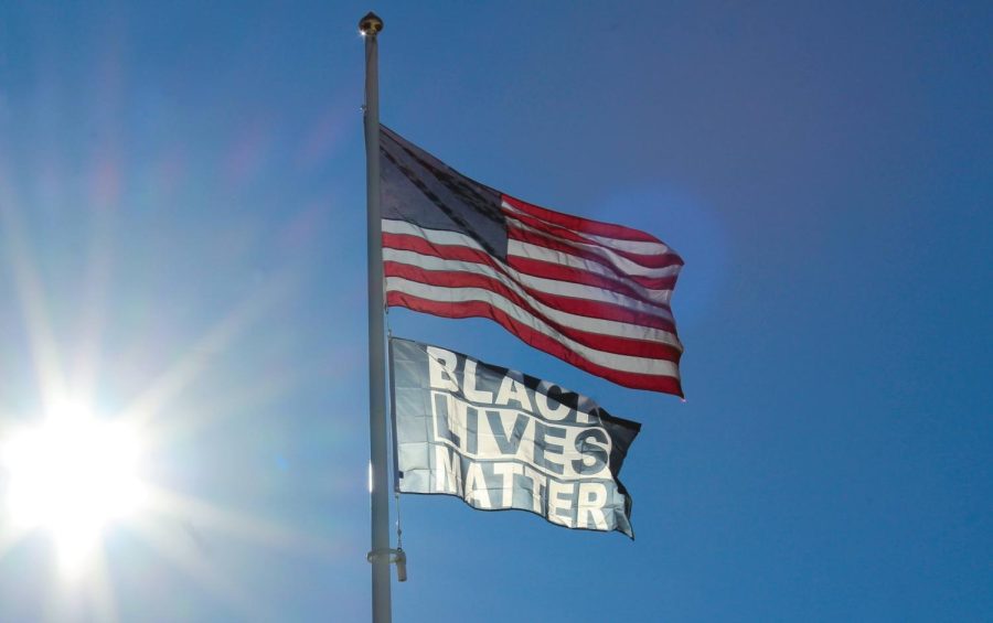The+American+flag+and+the+Black+Lives+Matter+flag+fly+outside+of+the+German+Club%2C+West+Haven%2C+Feb.+1%2C+2022.