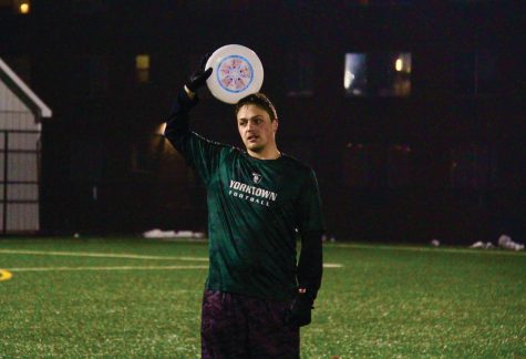 Justyn Mikulewicz prepares to throw a disc during practice at Kayo Field, West Haven, Feb. 7, 2022.