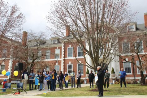 Members of the university community gather outside of Maxcy Hall in support of Ukraine, West Haven, April 1, 2022.