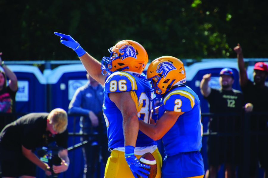 New Havens Kevin Foelsch (left) and Chris Carlyle (right) celebrate a touchdown, West Haven, Sept. 10, 2022.