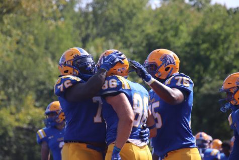Players on the New Haven football team celebrate after a touchdown against AIC, Sept. 17, 2022. 