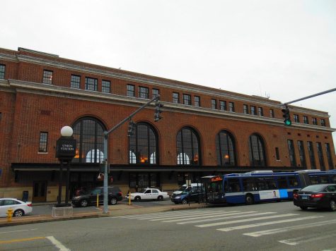 Cars drive by the entrance to Union Station, New Haven, 2018. 