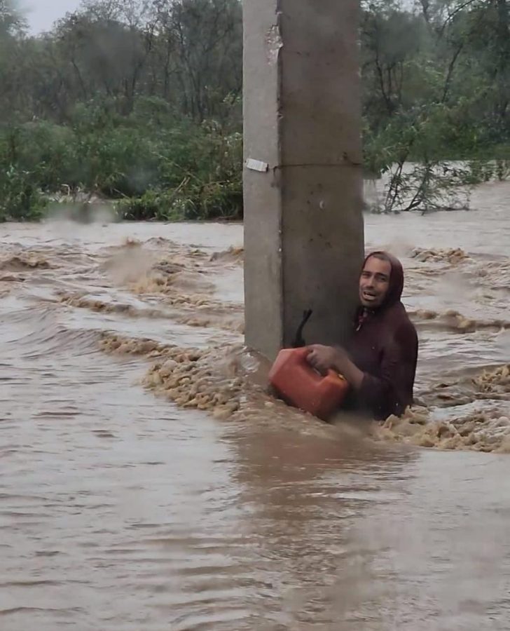 A+Puerto+Rican+man+battles+flood+waters+during+Hurricane+Fiona.+