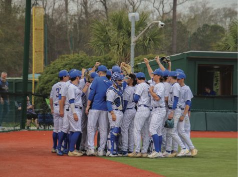The New Haven baseball team huddles before facing Wilmington, Myrtle Beach, S.C., Feb. 24, 2023.
