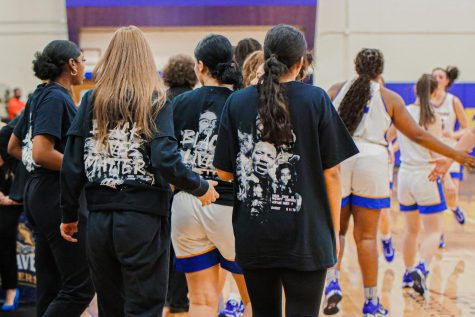 The New Haven women’s basketball team wears “Black Lives Matter” shirts against the College of Staten Island, West Haven, Feb. 15, 2023.