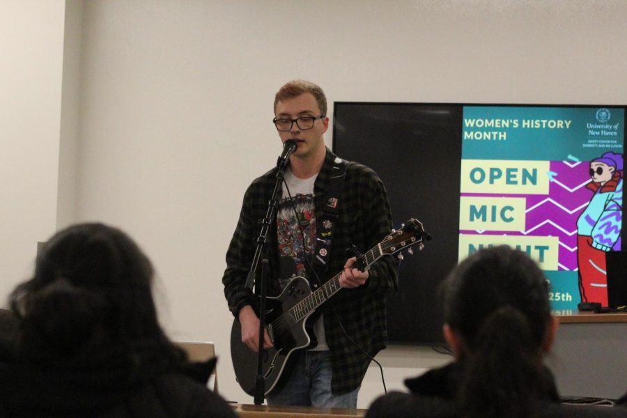 WIll Hink performing songs written by women in the Bergami Center, West Haven, March 25, 2023.