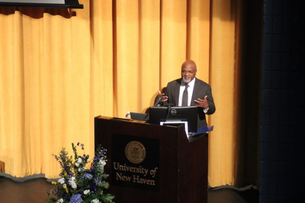 Chief Justice Richard A. Robinson speaking in Bucknall Theater, West Haven, Feb. 10, 2024.
