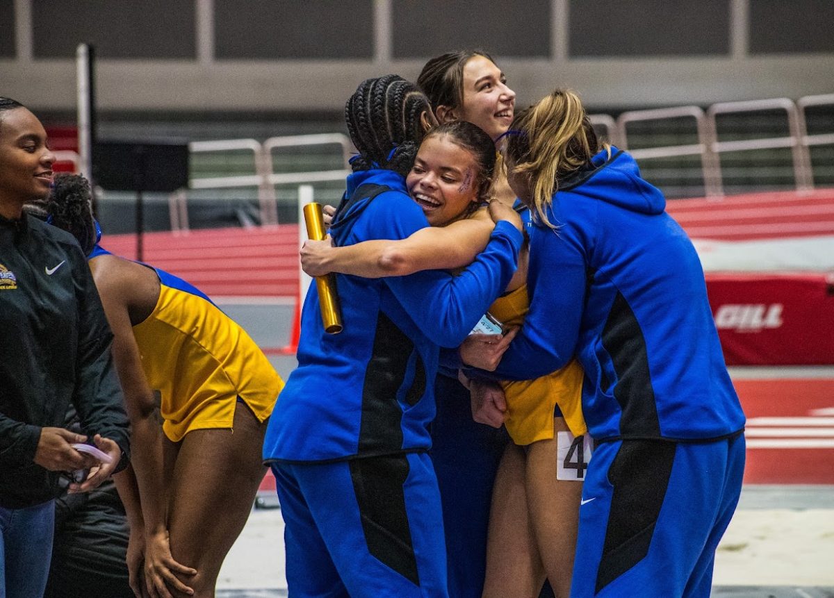 Members of the womens track team celebrate their win, Boston, Feb. 17, 2024.