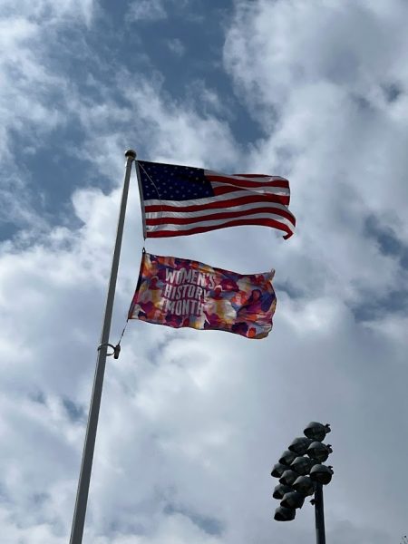 Women’s History Month flag hanging above Kathy Zolad Stadium, West Haven, March 23, 2024.