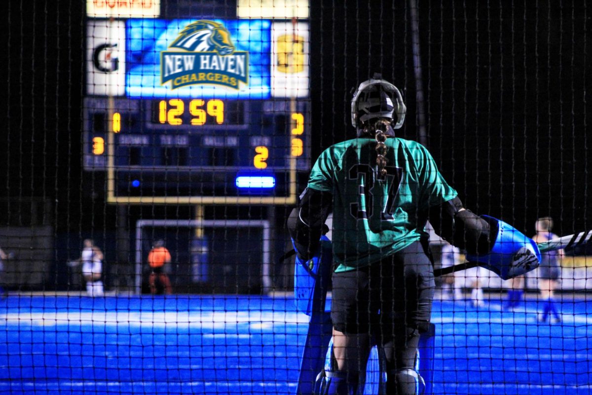 Cara Lambert defends the goal against St. Thomas Aquinas College