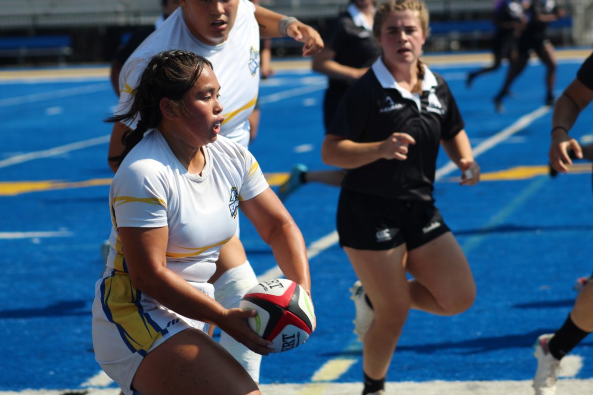 Sydney Dela Cruz running with ball, West Haven, Sept. 14, 2024.