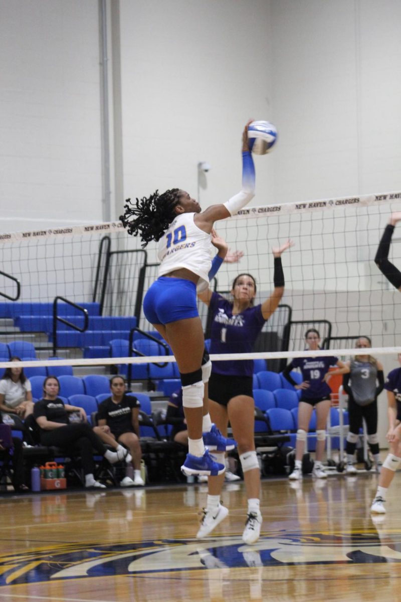 Naliah Grannell spikes the ball against University of Bridgeport