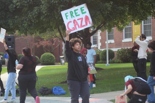 PRIDE President Aj Stack protesting in the Maxcy Quad