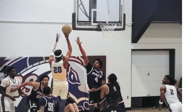 #20 Ethan Simmon shooting in game against Pace University,