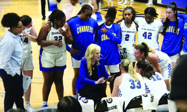 Women's basketball with their coach in game against Pace University