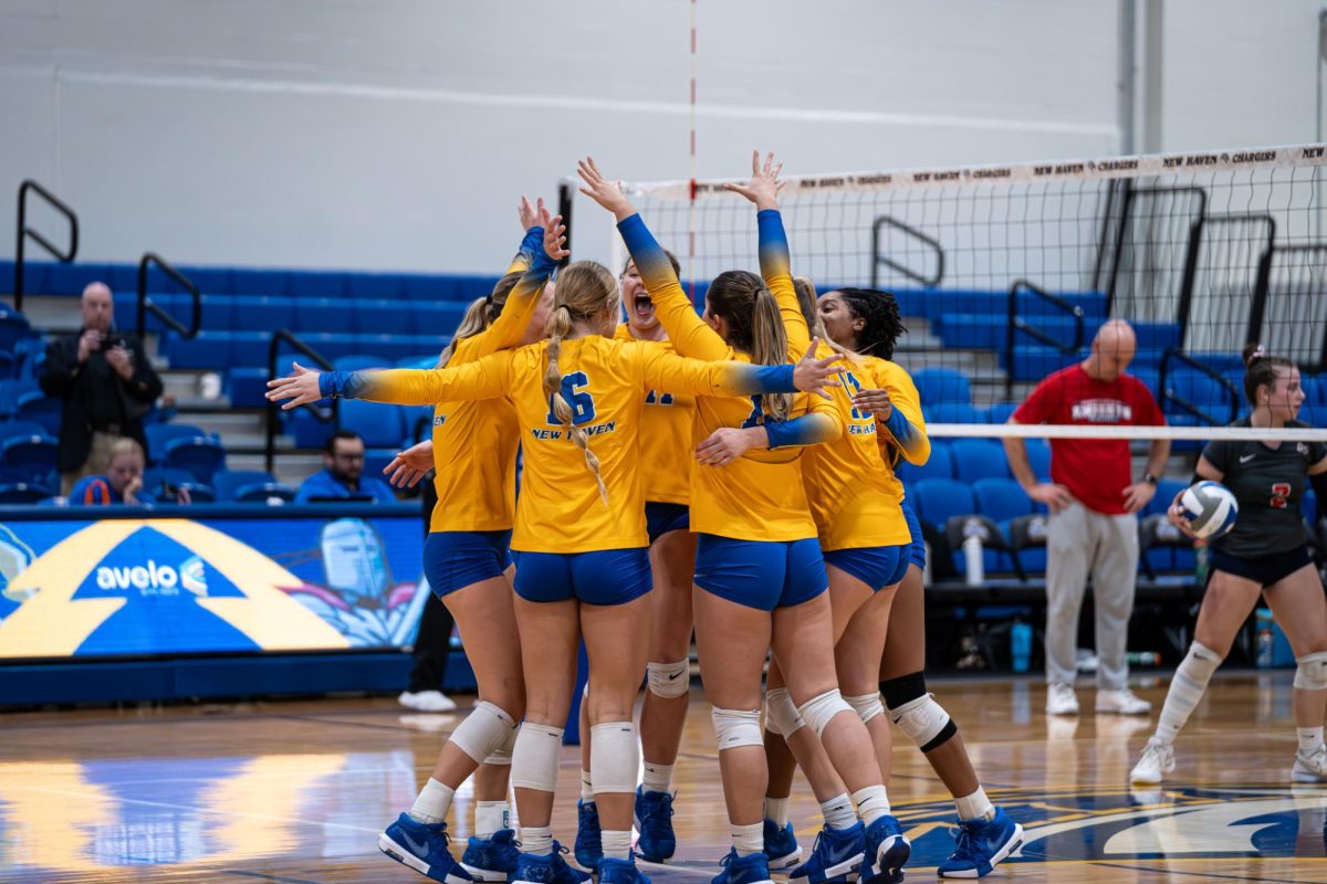 Chargers celebrate a point in the respective set